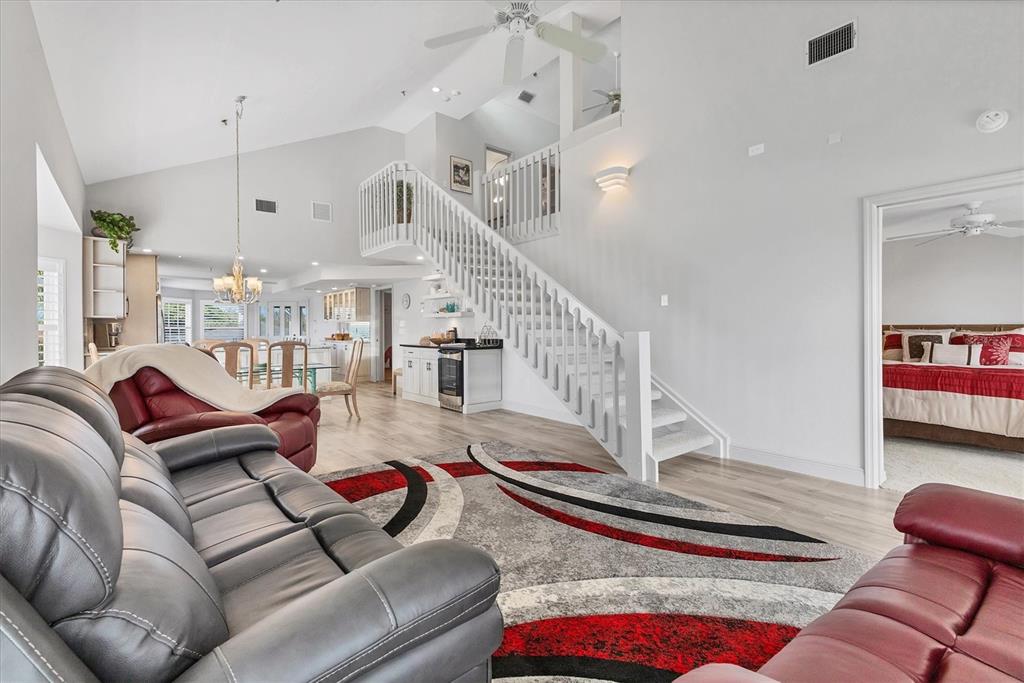 11000 Placida Road, Unit 1604 Placida, FL 33946 - Photo 14 of 42 a living room with furniture and wooden floor