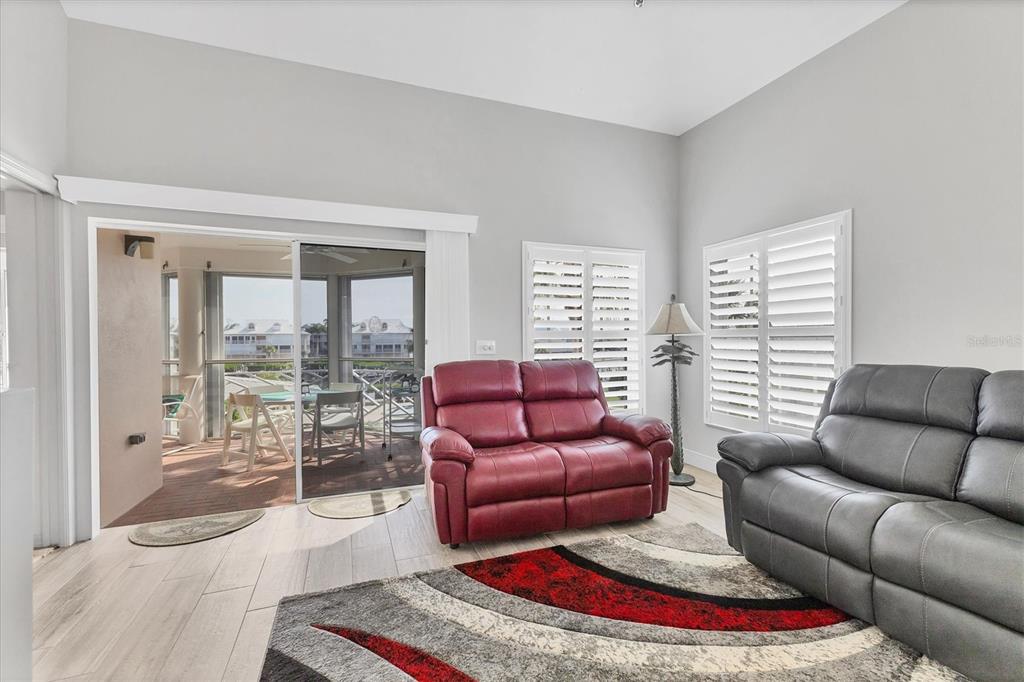 11000 Placida Road, Unit 1604 Placida, FL 33946 - Photo 16 of 42 a living room with furniture and a large window