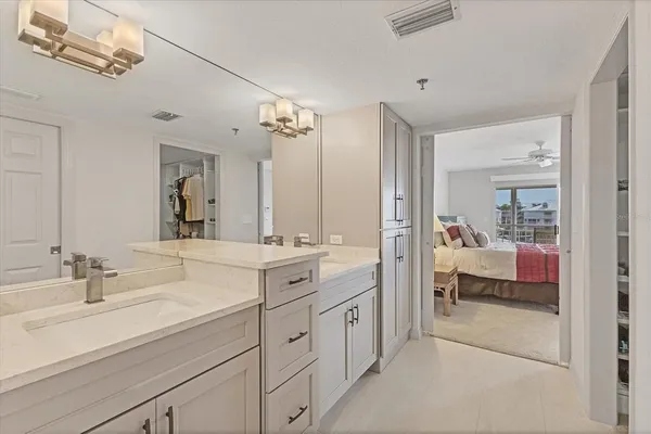 a en suite bathroom with double sink and a mirror