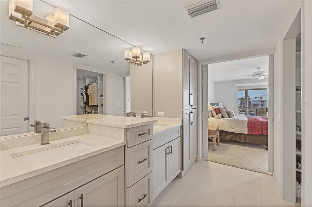 11000 Placida Road, Unit 1604 Placida, FL 33946 - Photo 19 of 42 a en suite bathroom with double sink and a mirror