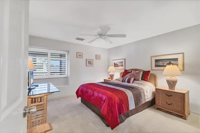 a bathroom with a granite countertop sink a toilet and a mirror