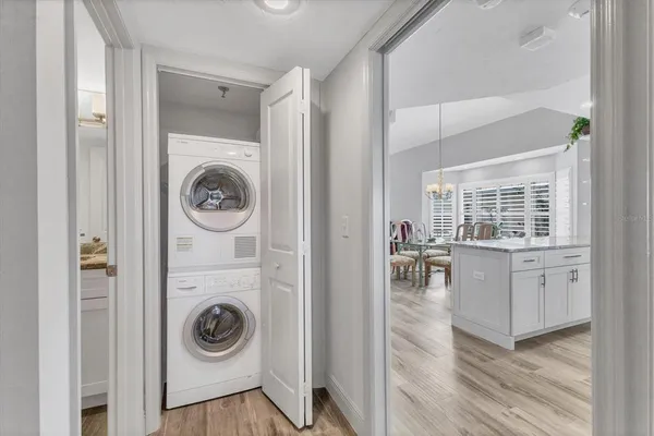 a view of a hallway with washer and dryer