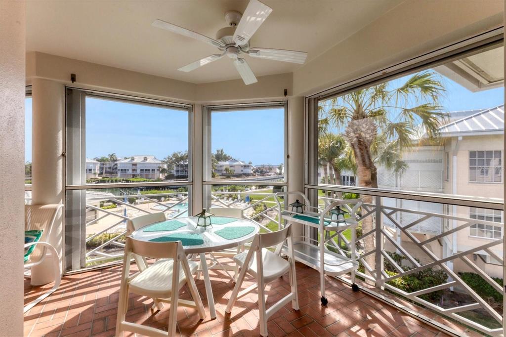 11000 Placida Road, Unit 1604 Placida, FL 33946 - Photo 28 of 42 a living room with furniture and a large window