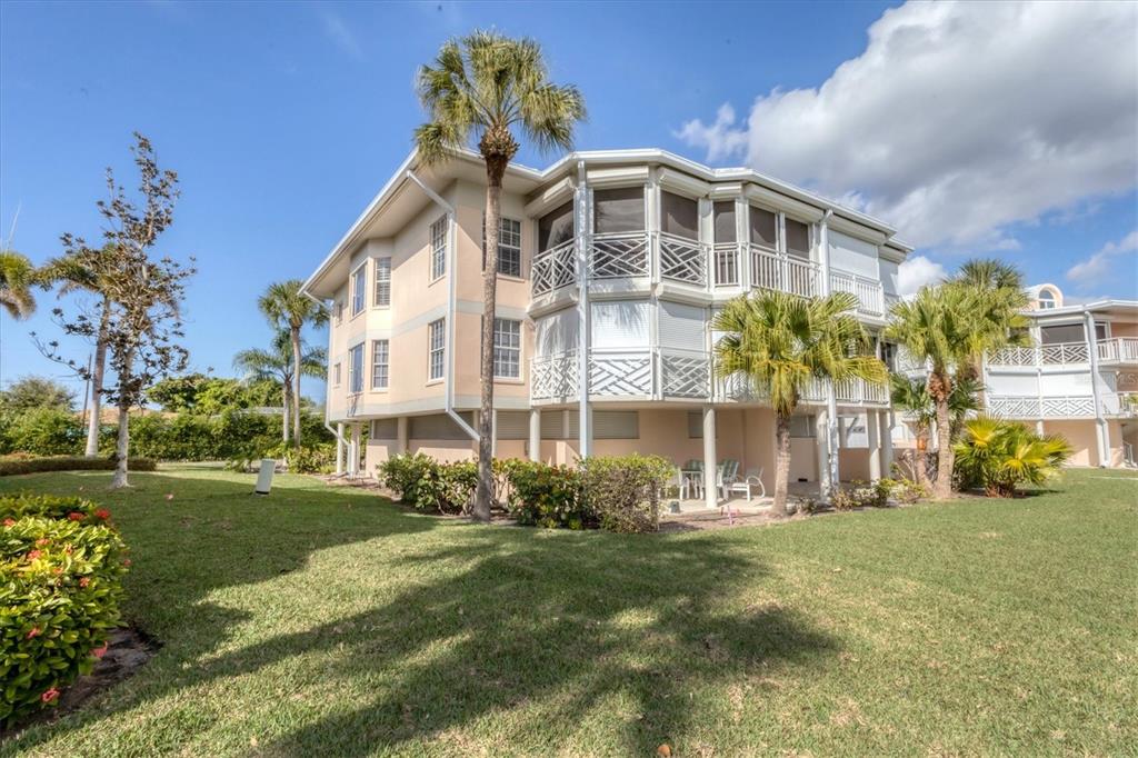 11000 Placida Road, Unit 1604 Placida, FL 33946 - Photo 31 of 42 a front view of a house with garden