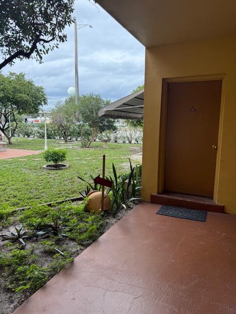 a view of a garden with an outdoor seating