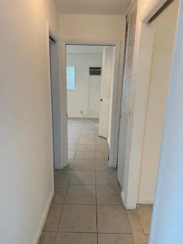 a view of a bathroom with a sink and a mirror