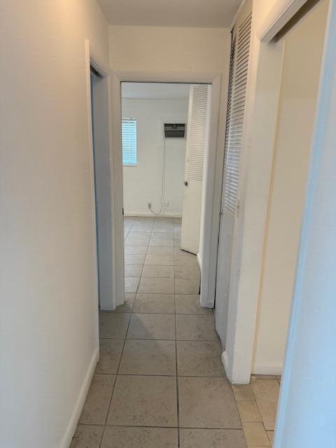 1050 East Sample Road, Unit 101 Pompano Beach, FL 33064 - Photo 11 of 24 a view of a bathroom with a sink and a mirror