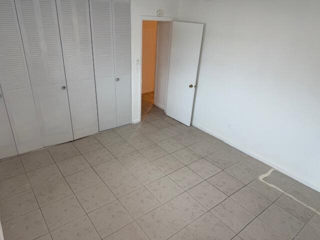 1050 East Sample Road, Unit 101 Pompano Beach, FL 33064 - Photo 14 of 24 a view of an empty room