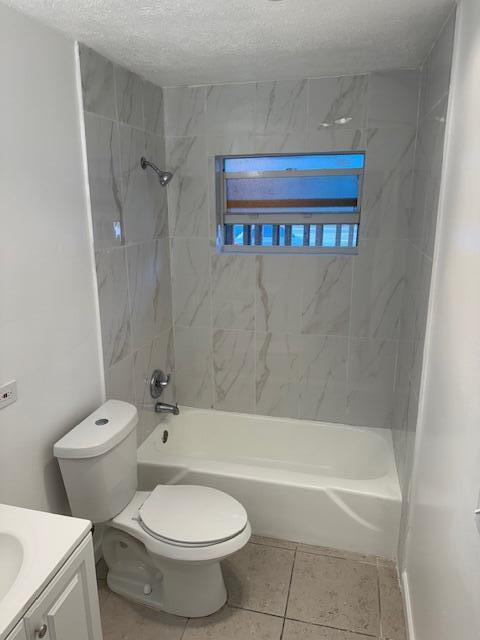 1050 East Sample Road, Unit 101 Pompano Beach, FL 33064 - Photo 20 of 24 a bathroom with a toilet and a bath tub