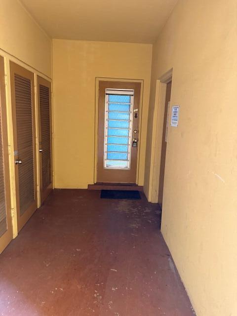 1050 East Sample Road, Unit 101 Pompano Beach, FL 33064 - Photo 2 of 24 a view of empty room with windows