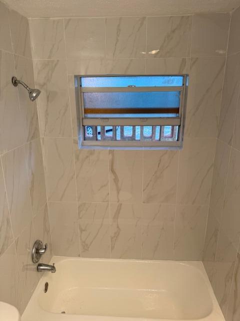 1050 East Sample Road, Unit 101 Pompano Beach, FL 33064 - Photo 21 of 24 a bathroom with a bathtub