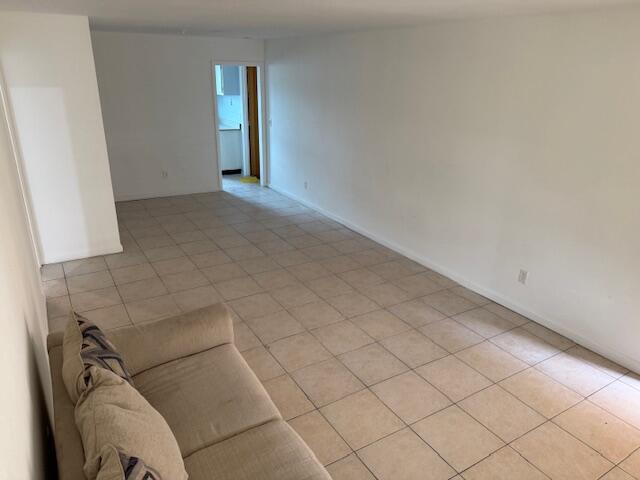 1050 East Sample Road, Unit 101 Pompano Beach, FL 33064 - Photo 3 of 24 a view of livingroom and window