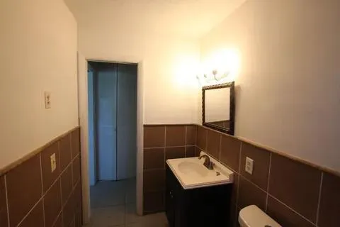 a bathroom with a sink and mirror
