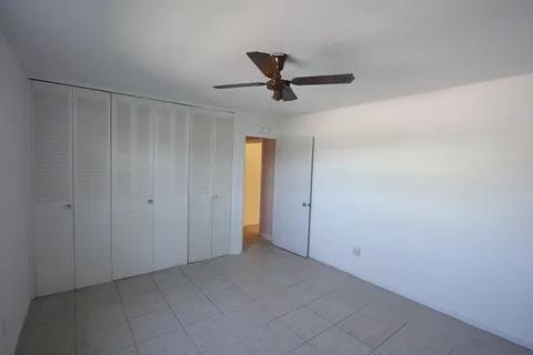 1050 East Sample Road, Unit 101 Pompano Beach, FL 33064 - Photo 9 of 19 a view of an empty room