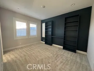 a view of an empty room with a closet