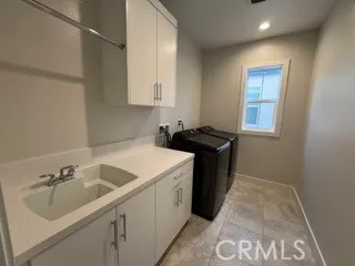 a kitchen that has a sink and a stove