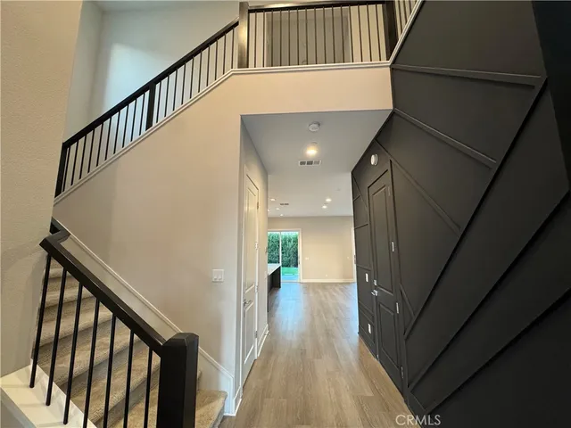 a view of a hallway view with staircase