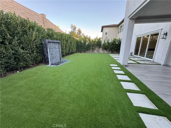 a backyard of a house with lots of green space