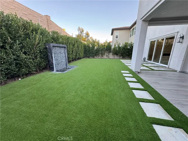 a backyard of a house with lots of green space