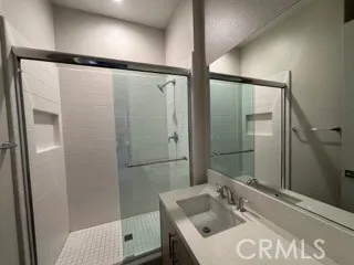 a bathroom with a sink and shower