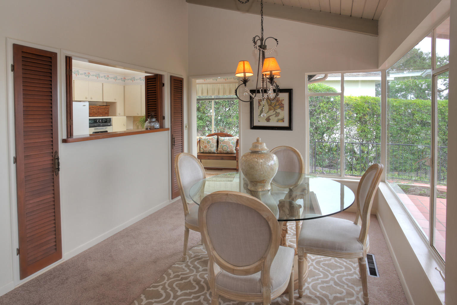 1605 Paterna Road Santa Barbara, CA 93103 - Photo 11 of 26 a dining room with furniture a chandelier and wooden floor