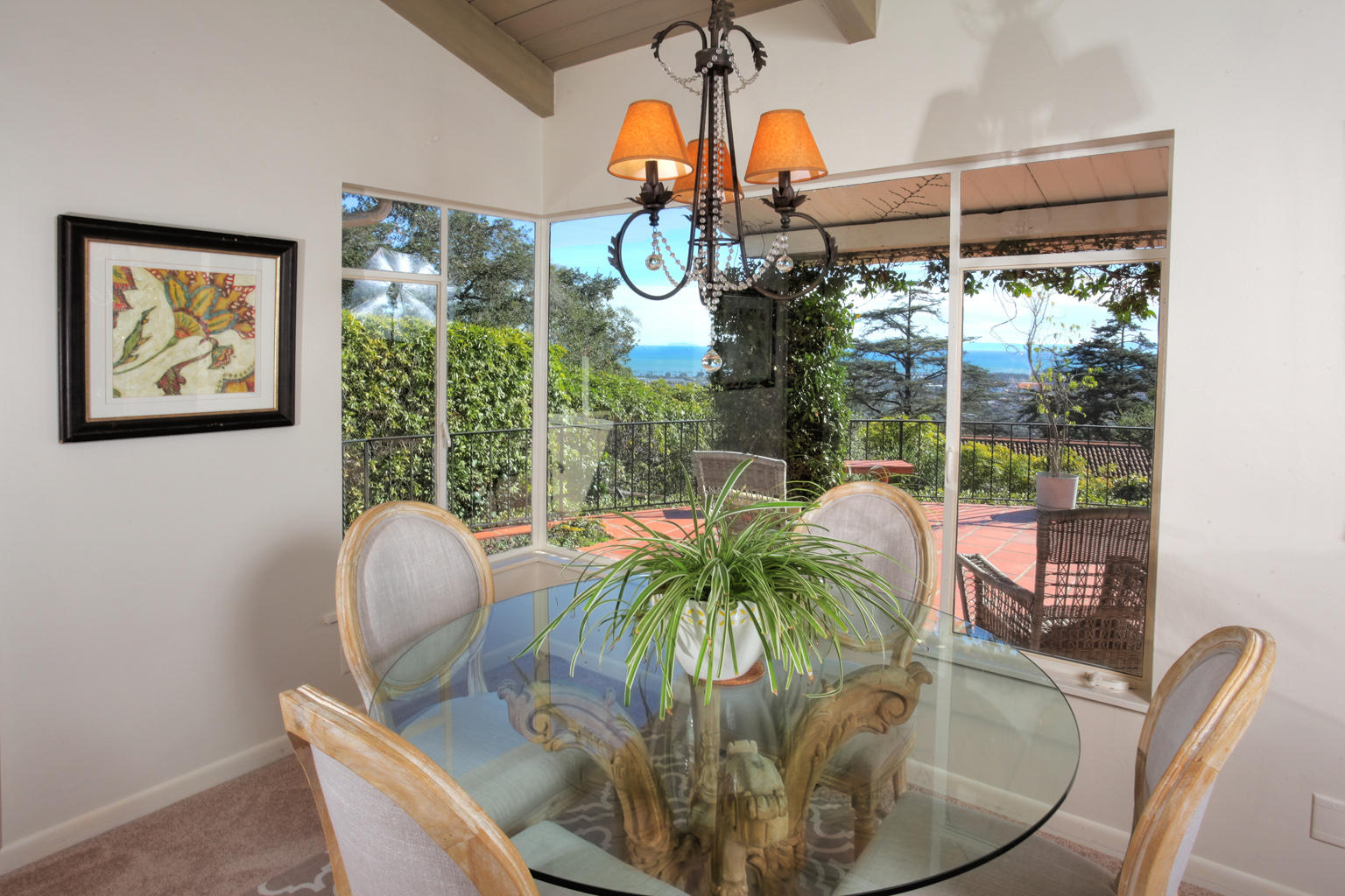 1605 Paterna Road Santa Barbara, CA 93103 - Photo 12 of 26 a view of a dining room with furniture wooden floor and chandelier