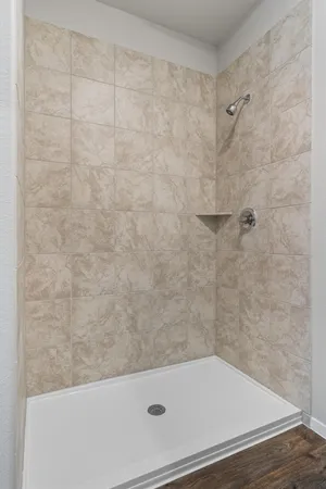 a bathroom with a tub and a shower