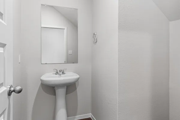 a bathroom with a sink and mirror