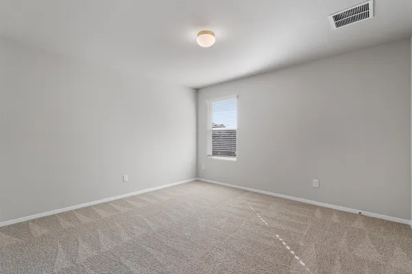 an empty room with closet area