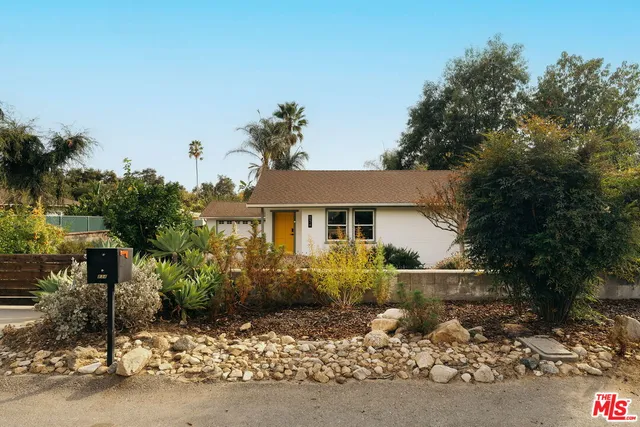 front view of a house with a street