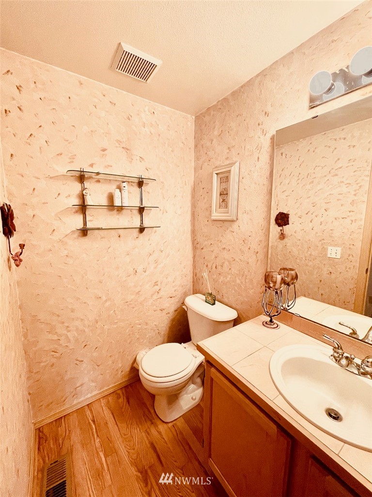 502 South 53rd Place Renton, WA 98055 - Photo 11 of 23 a bathroom with a sink and a mirror