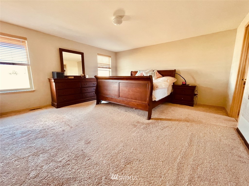 502 South 53rd Place Renton, WA 98055 - Photo 14 of 23 a bedroom with a bed and a window
