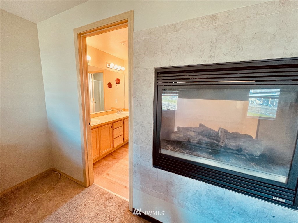 502 South 53rd Place Renton, WA 98055 - Photo 16 of 23 a view of a living room with a wooden floor
