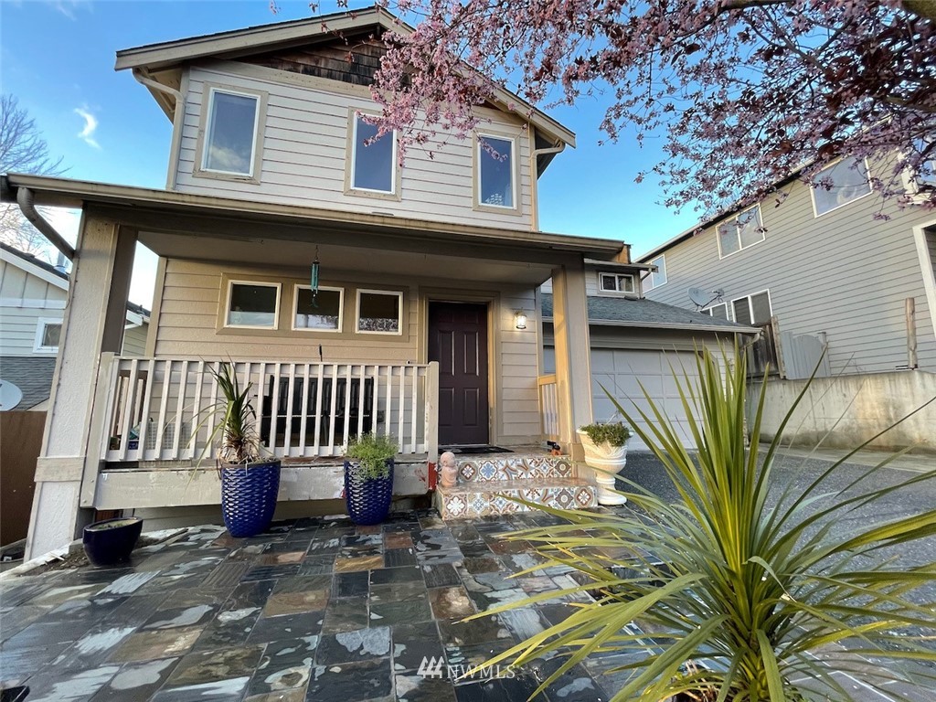 502 South 53rd Place Renton, WA 98055 - Photo 3 of 23 a view of a house with a small yard and wooden floor and fence