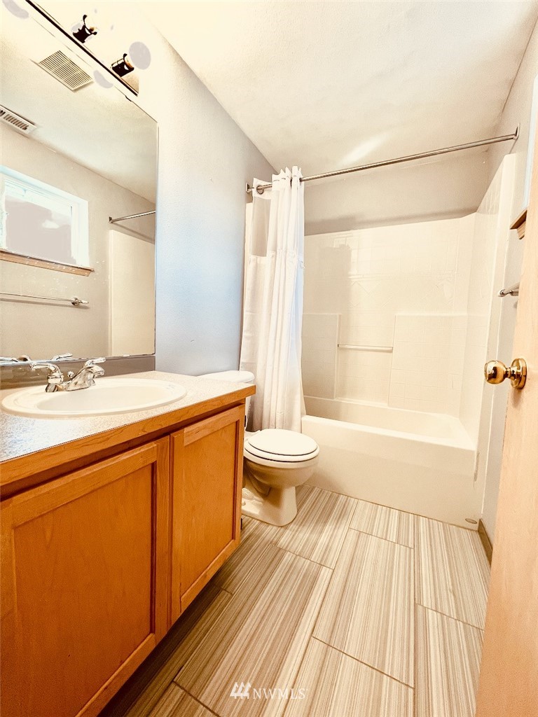 502 South 53rd Place Renton, WA 98055 - Photo 21 of 23 a bathroom with a sink a toilet and shower