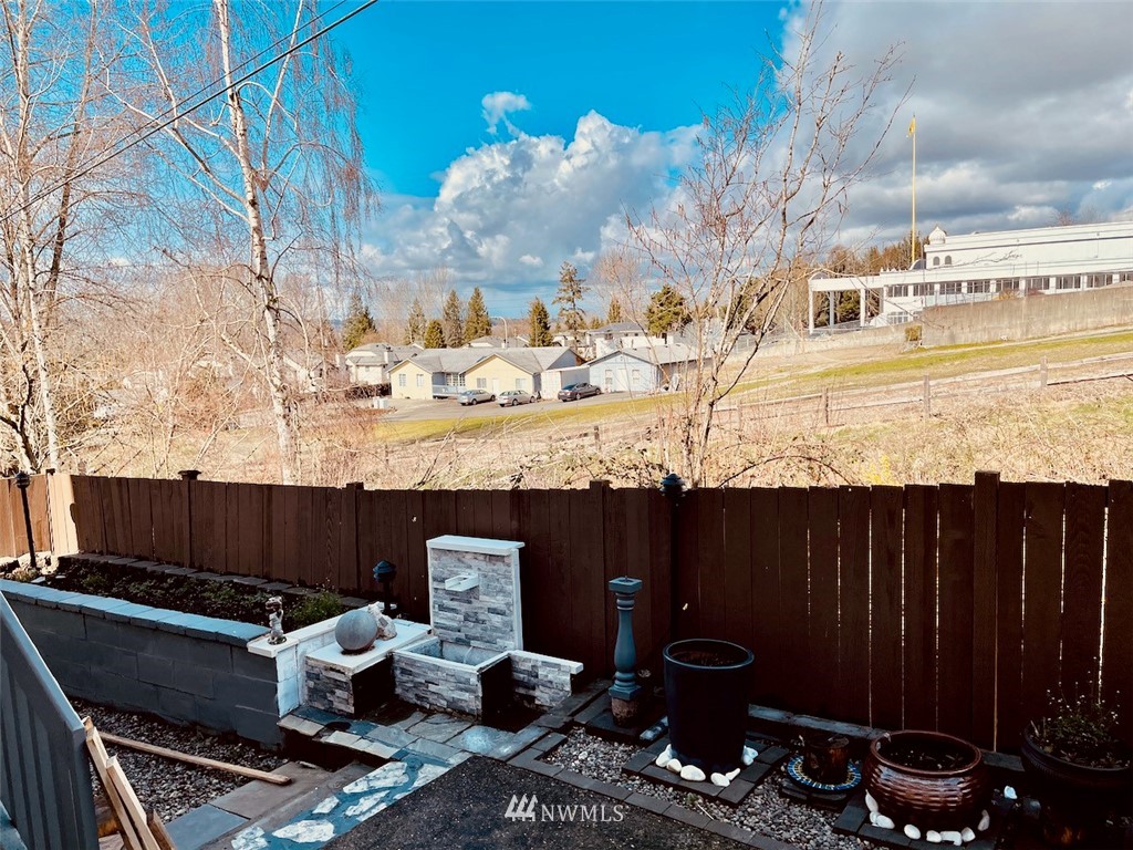 502 South 53rd Place Renton, WA 98055 - Photo 23 of 23 a view of a balcony with plants and wooden fence