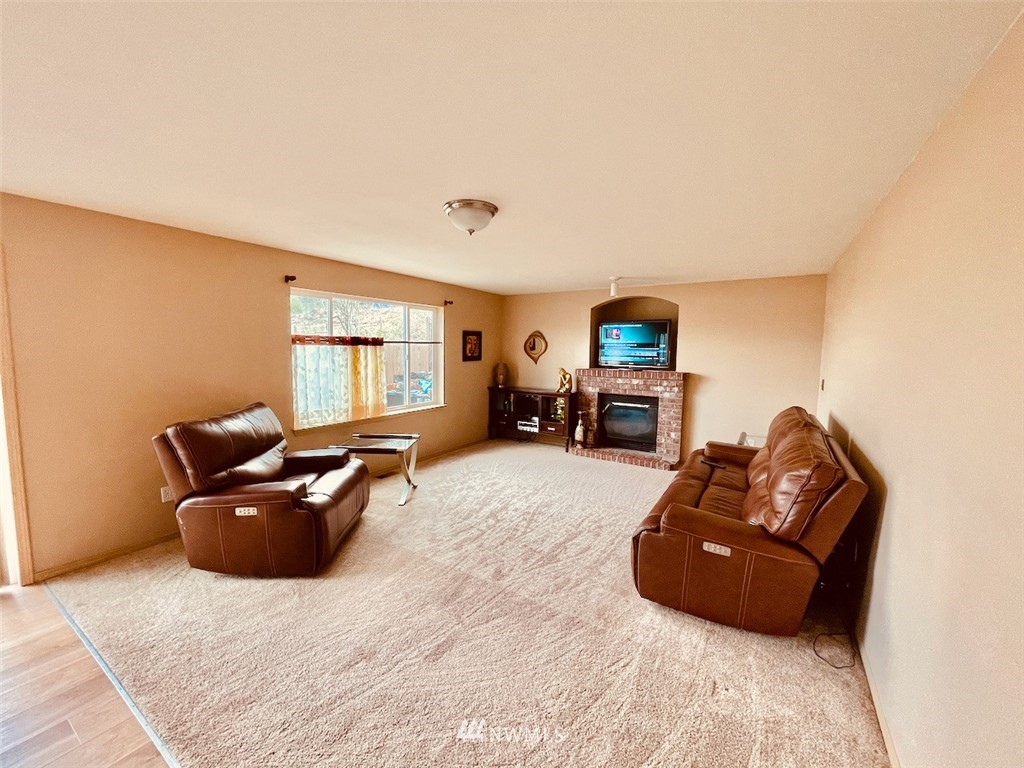 502 South 53rd Place Renton, WA 98055 - Photo 8 of 23 a living room with furniture and a window