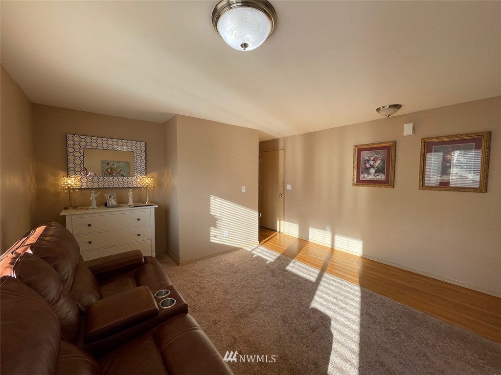 502 South 53rd Place Renton, WA 98055 - Photo 10 of 23 a bedroom with furniture and a wooden floor