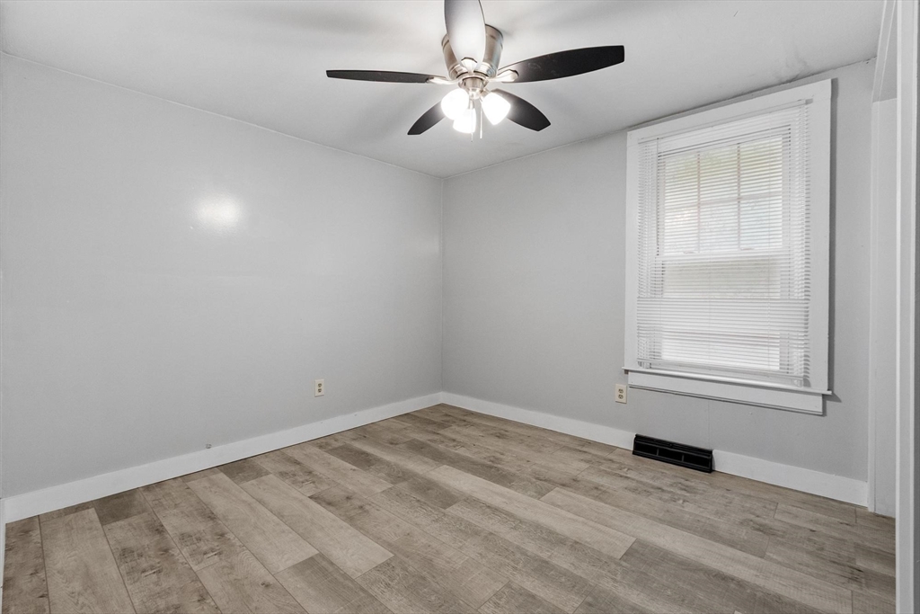 258 Allen Road Ashby, MA 01431 - Photo 17 of 36 an empty room with windows and fan