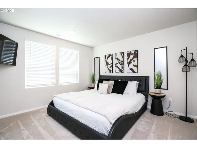 a bedroom with a bed and window