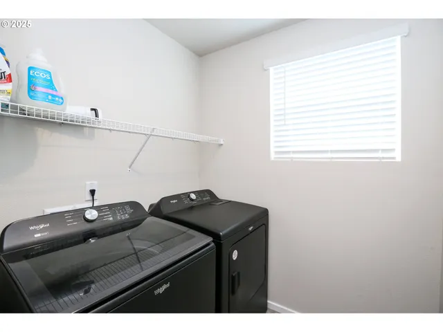 a kitchen with a sink cabinets and a window