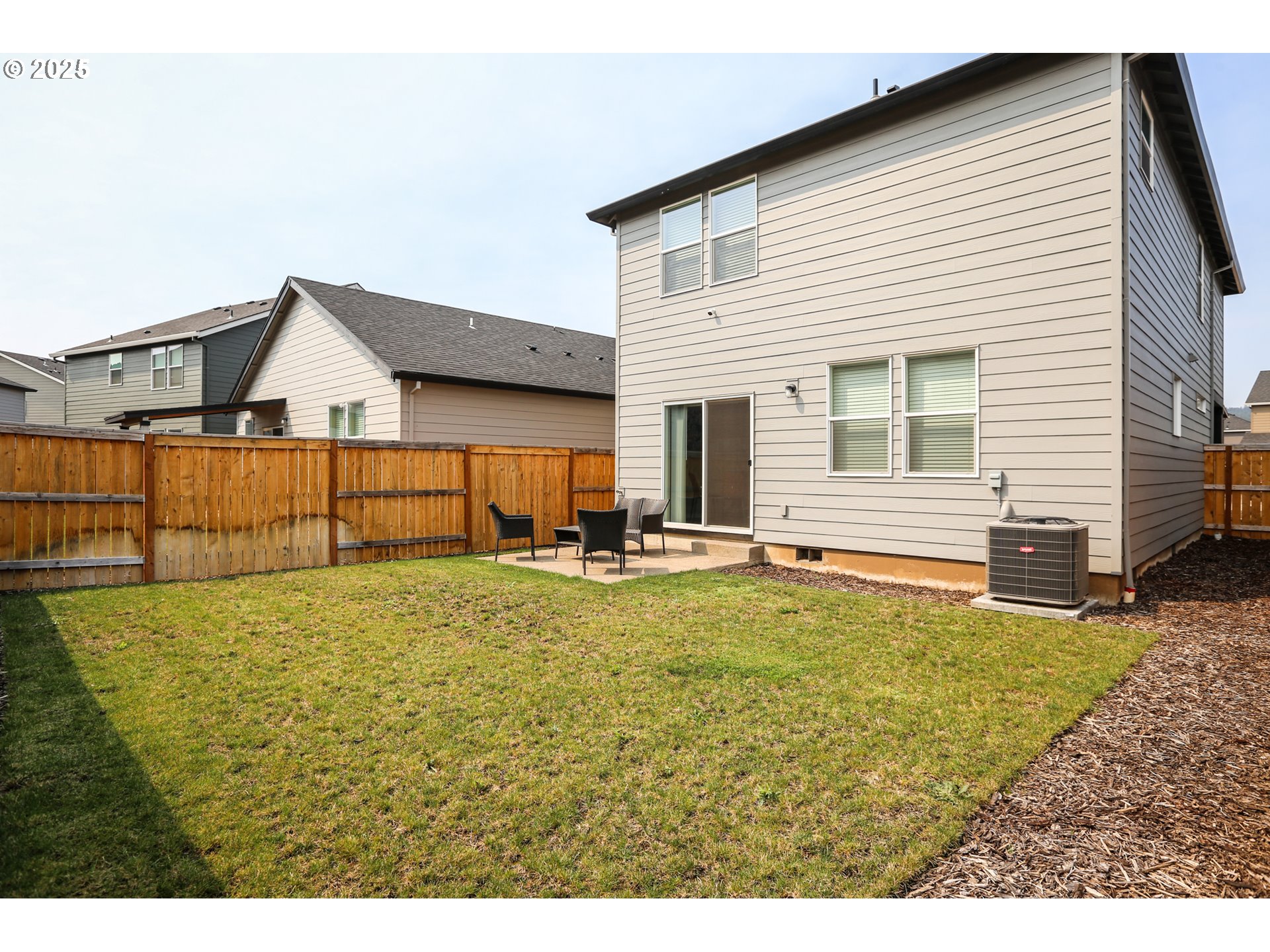 2685 V Street Springfield, OR 97477 - Photo 21 of 22 a view of a house with a yard and sitting area