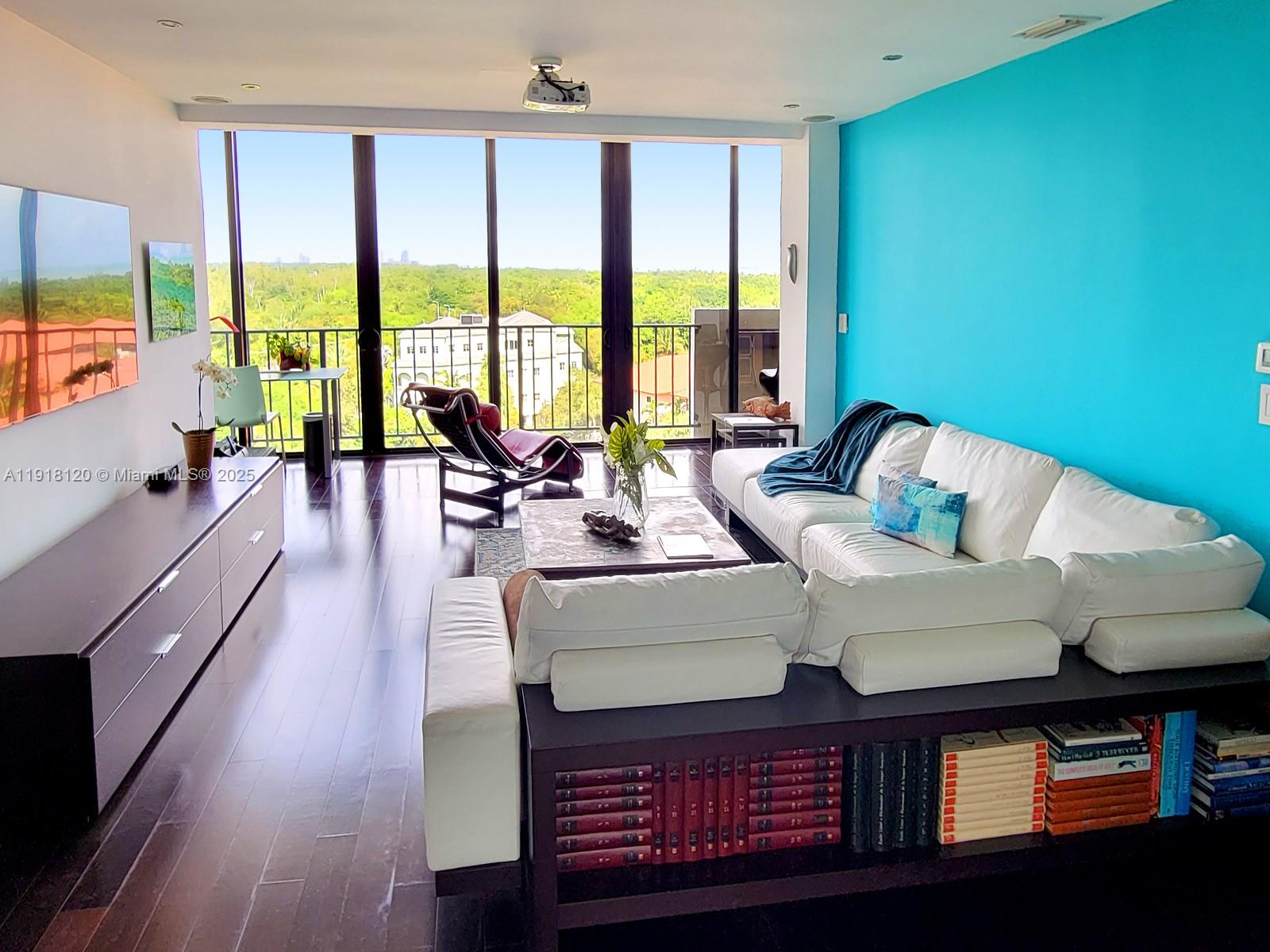 77 Crandon Boulevard, Unit 10A Key Biscayne, FL 33149 - Photo 2 of 15 a living room with furniture and large windows