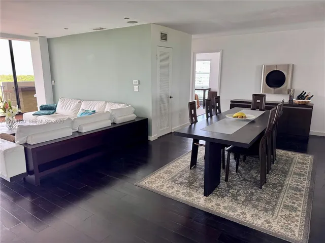 a view of a dining table and chairs in a room
