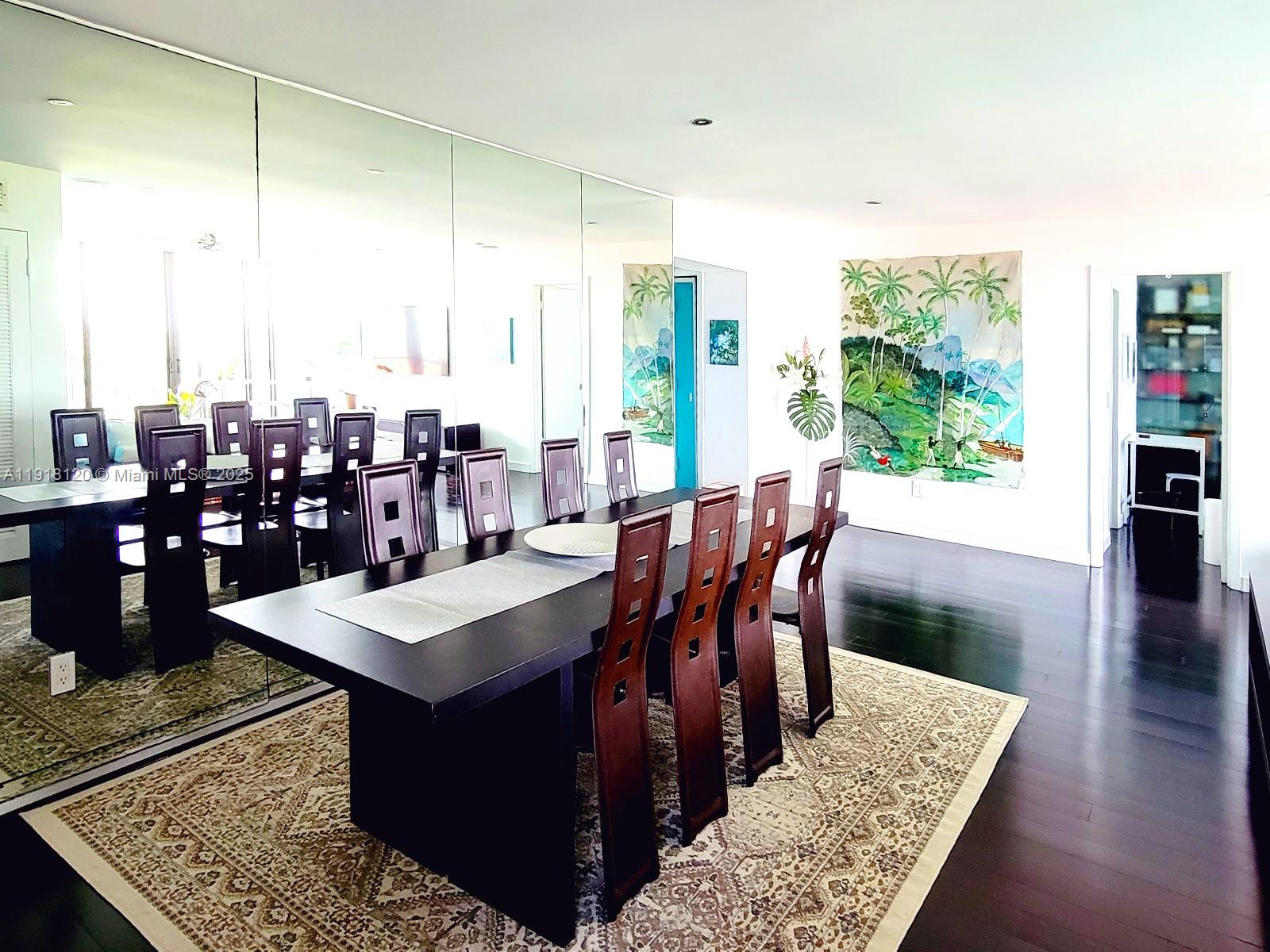 77 Crandon Boulevard, Unit 10A Key Biscayne, FL 33149 - Photo 5 of 15 a view of a dining table and chairs in a patio