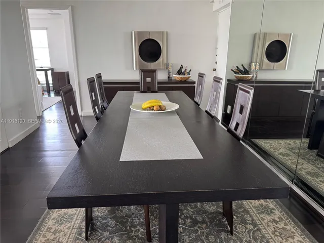 a view of kitchen appliances with wooden floor