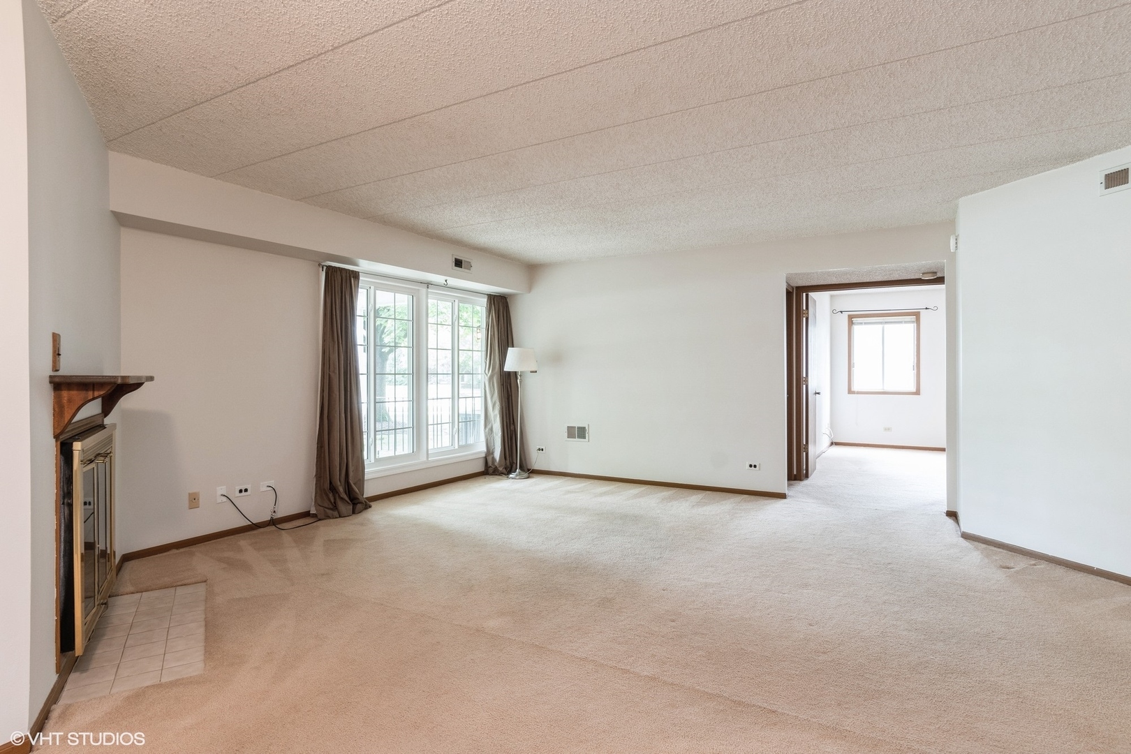 1258 Chalet Road, Unit 101 Naperville, IL 60563 - Photo 14 of 22 a view of an empty room with a window