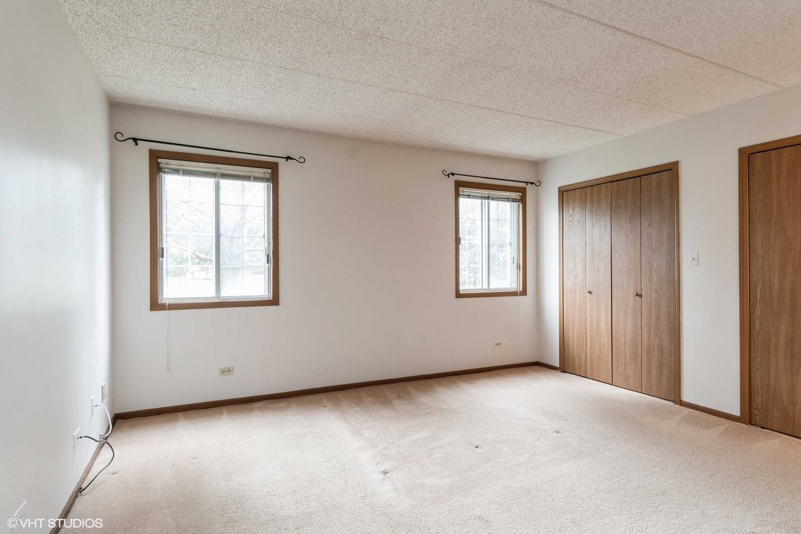 1258 Chalet Road, Unit 101 Naperville, IL 60563 - Photo 15 of 22 an empty room with windows