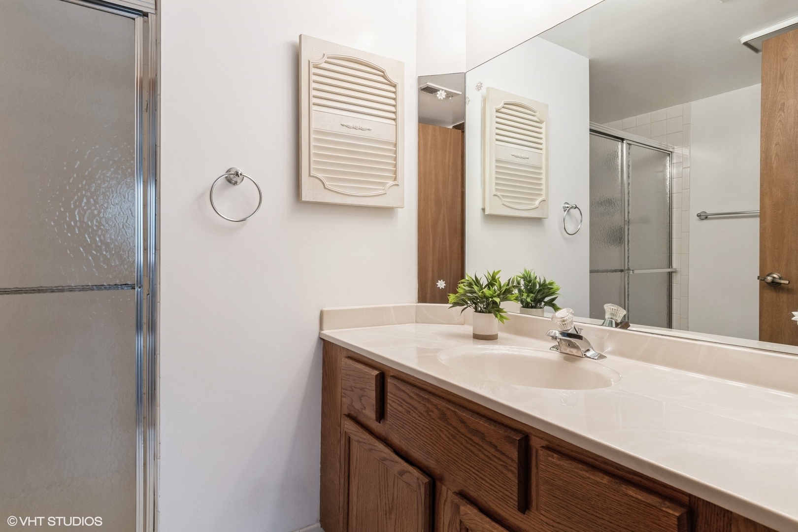 1258 Chalet Road, Unit 101 Naperville, IL 60563 - Photo 16 of 22 a bathroom with a sink and a mirror