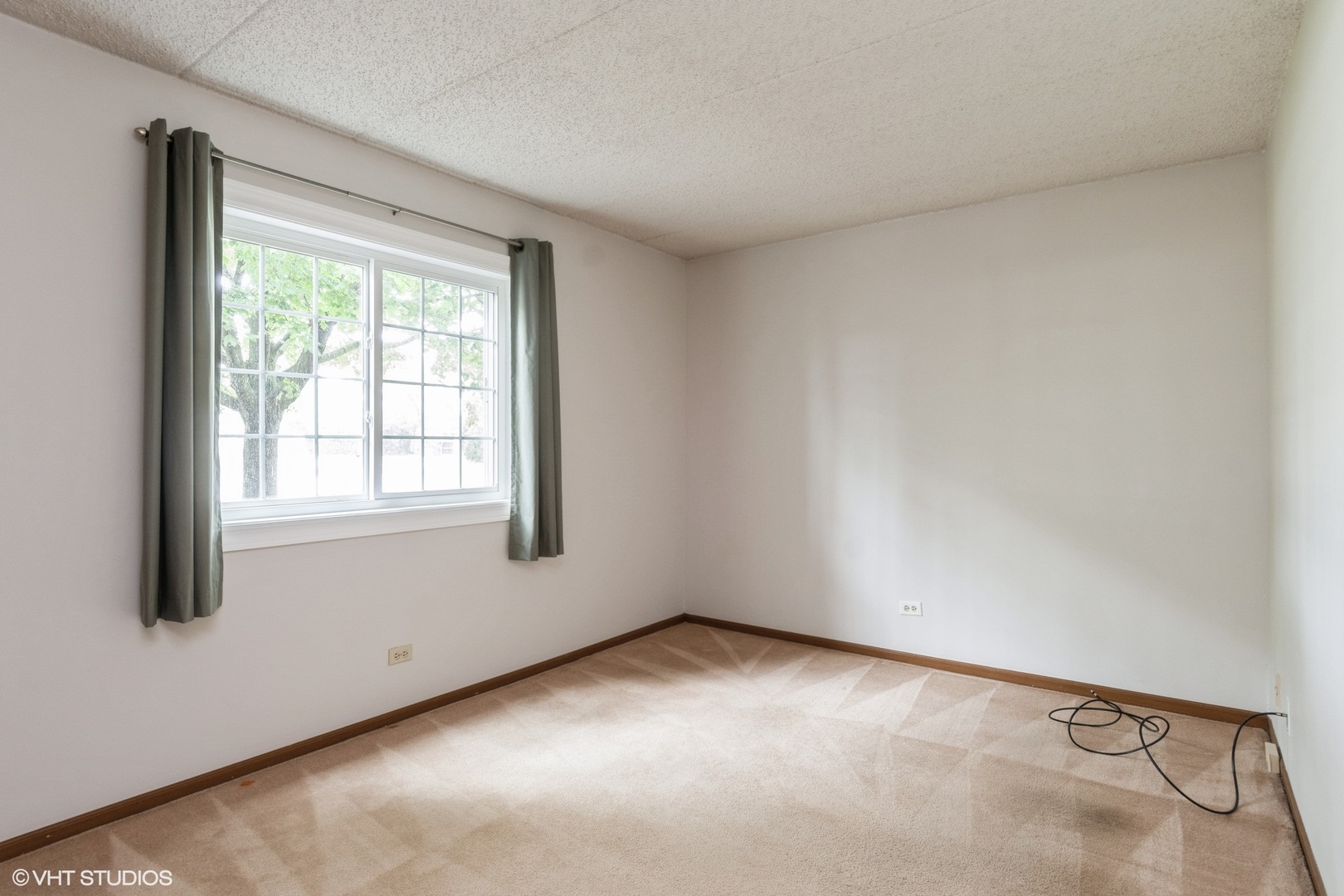 1258 Chalet Road, Unit 101 Naperville, IL 60563 - Photo 17 of 22 an empty room with a window
